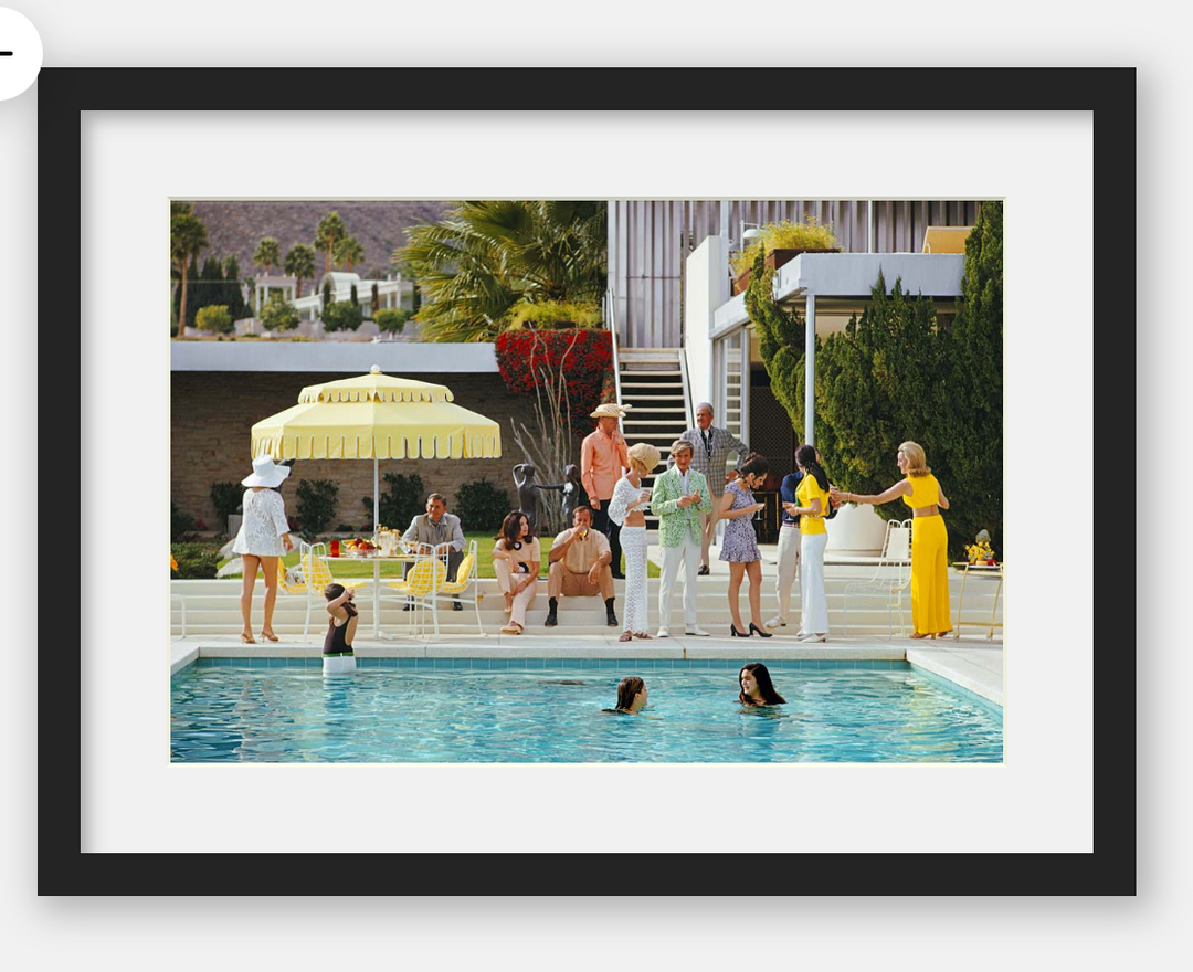 Framed artwork of a pool party scene with people around a pool.