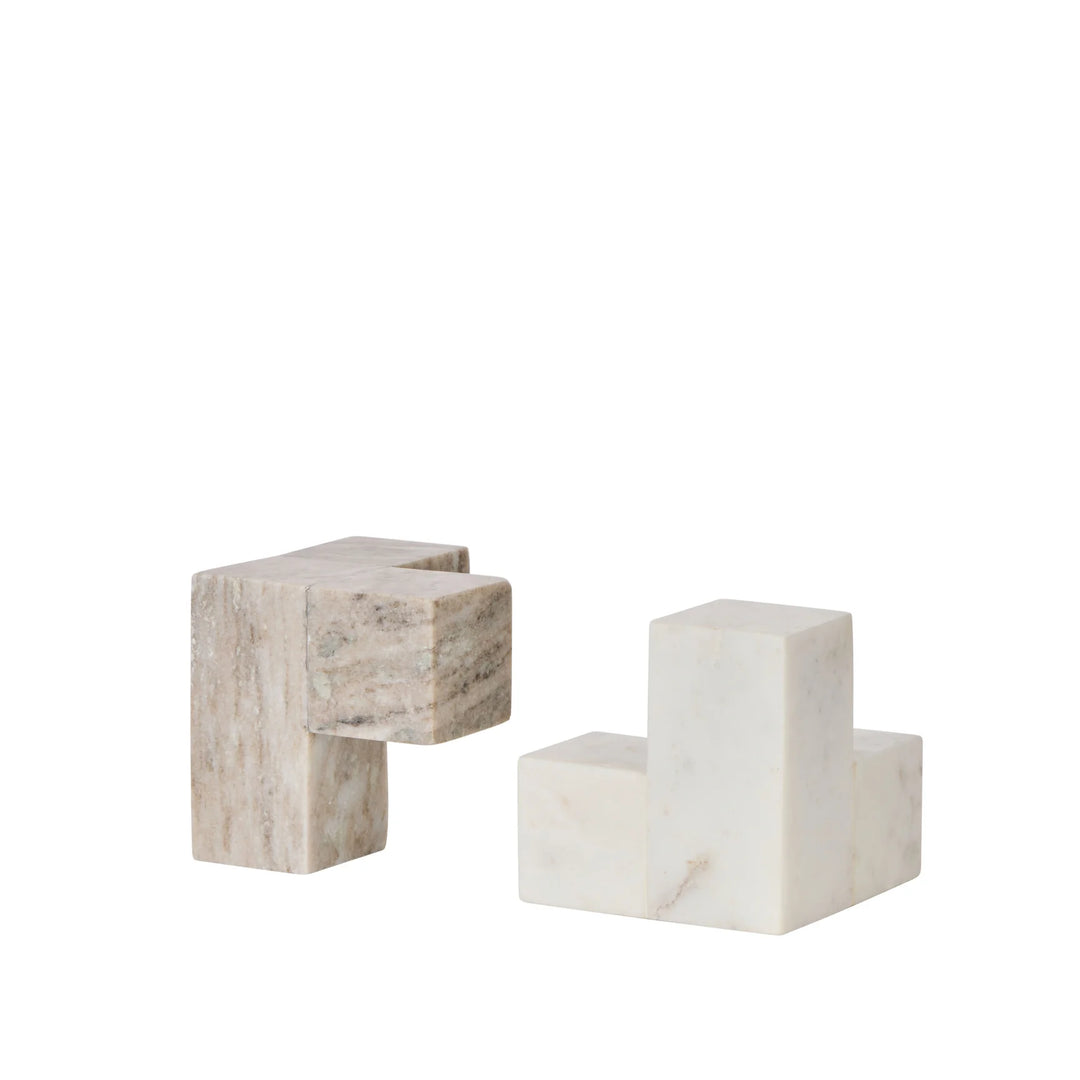 Hand made solid marble piece. Made from solid marble that celebrates the natural beauty of the material. As this is made from natural marble each piece is unique and variation is to be expected. Two geometric pieces that fit together in a two tone cube. Can be used as bookends or as a two tone sculpture. SIts back with with full Sachi range.

Material: White Marble/Beige Marble
Size: 12x12x12cm
Contents: 2 x Bookends Set of 2
