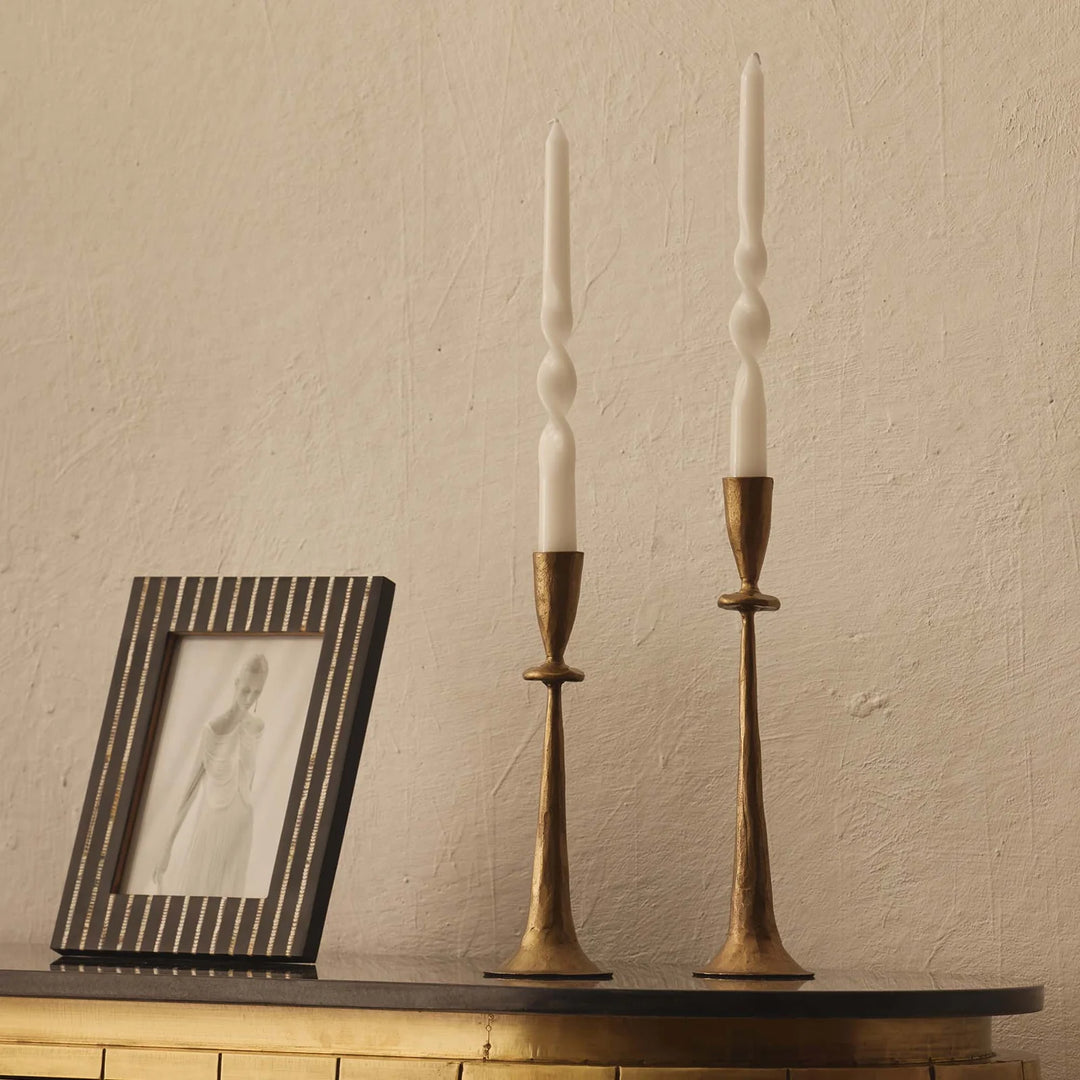 two aged brass candle holders