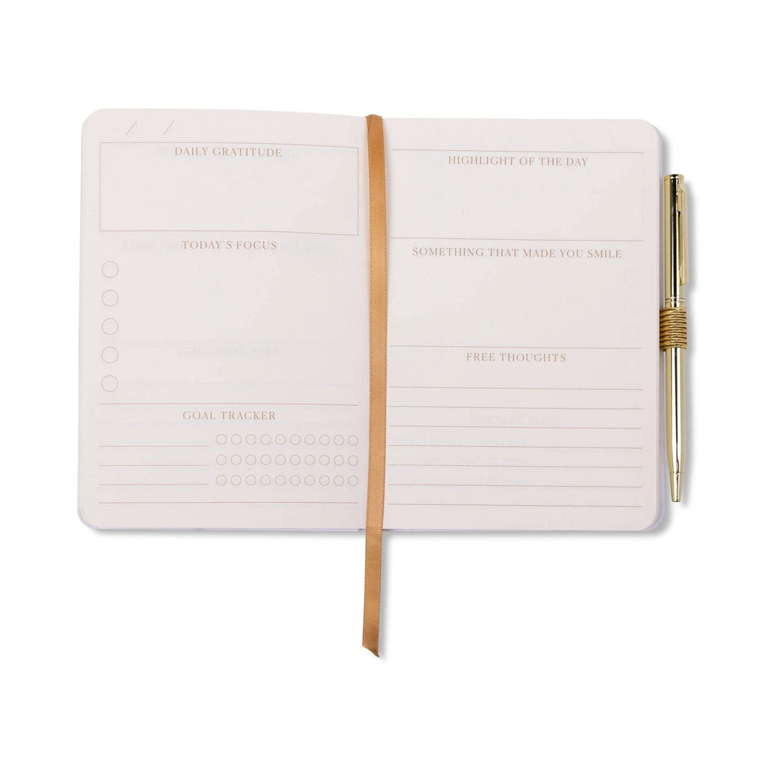 The DesignWorks Ink Gratitude Journal with a pen