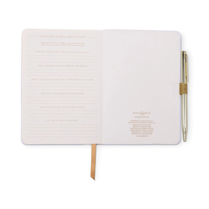The DesignWorks Ink Gratitude Journal with a pen